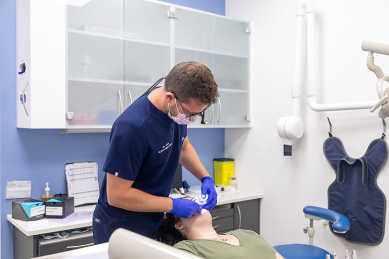 A dentist working on a patient.