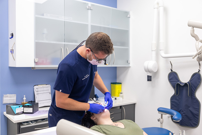 A dentist working on a patient.