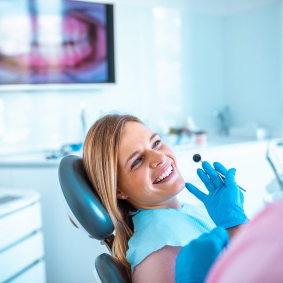 Female,Dentist,Working,On,A,Female,Patients,Teeth,In,Her